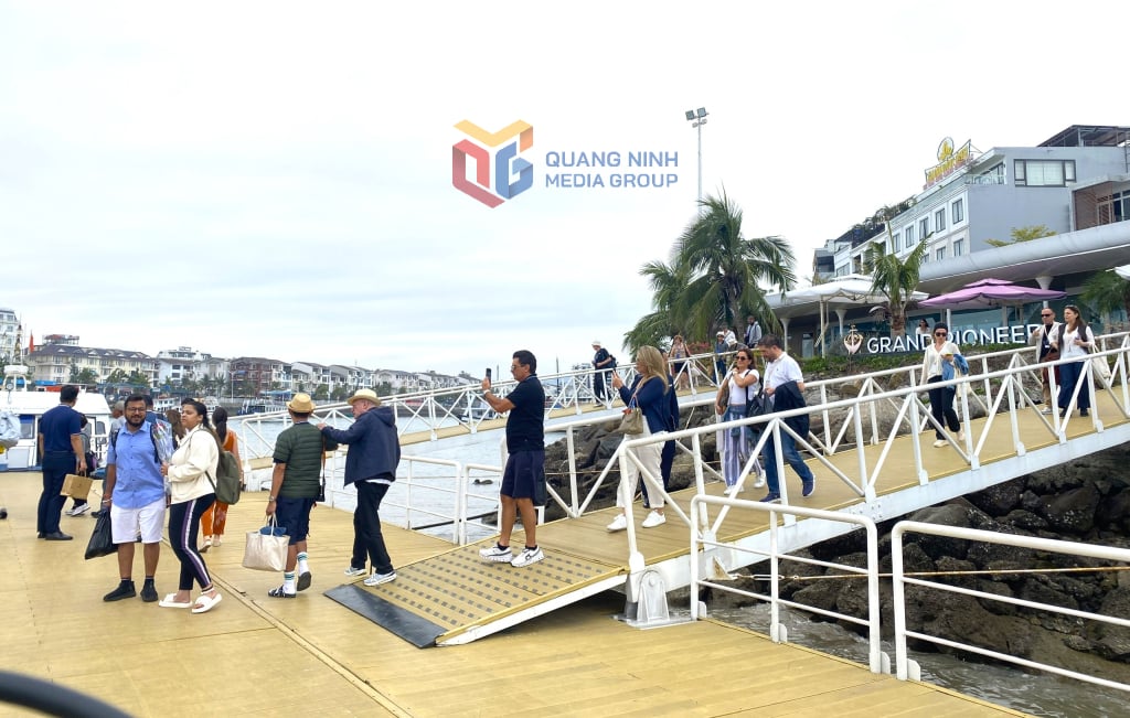 International tourists get off the ship to visit Ha Long Bay.