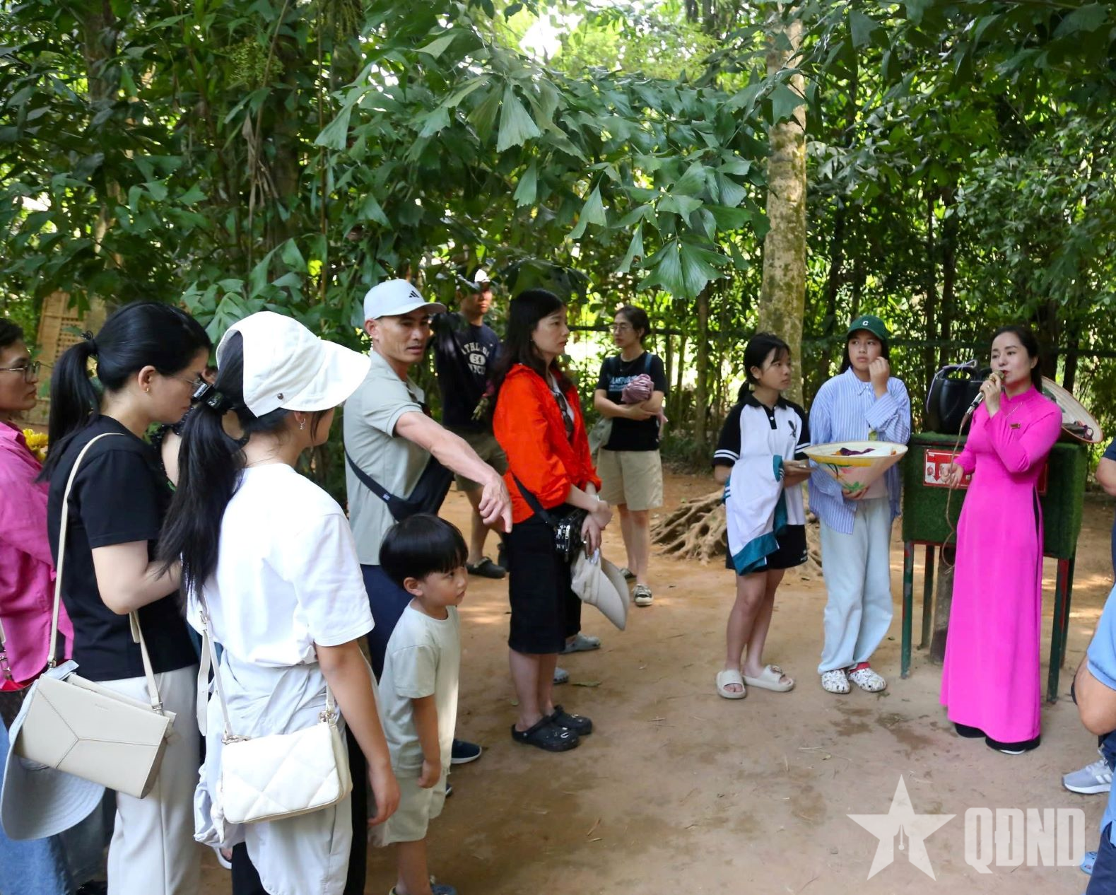 People listened to the tour guide tell touching stories about Uncle Ho's life.