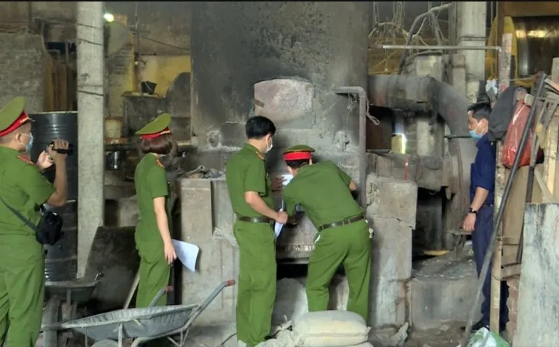 Authorities inspect a manufacturing facility.