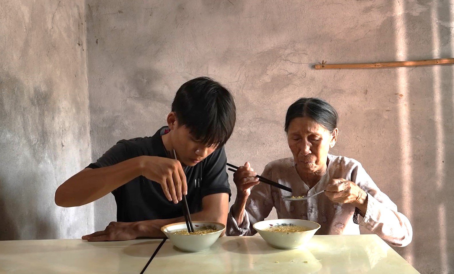 At the age of 17, Hung is both a student and the sole support for his frail 90-year-old grandmother.