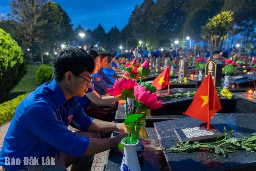 Youth Union members offer incense and light candles in gratitude at the martyrs' graves.