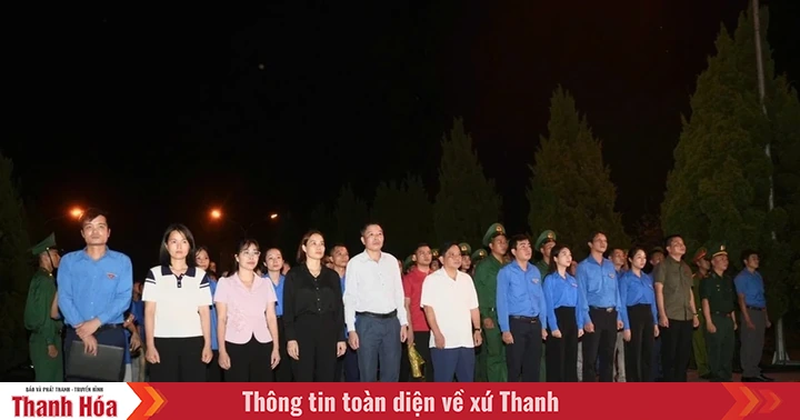 Offering incense in memory at Dong Tam International Martyrs Cemetery