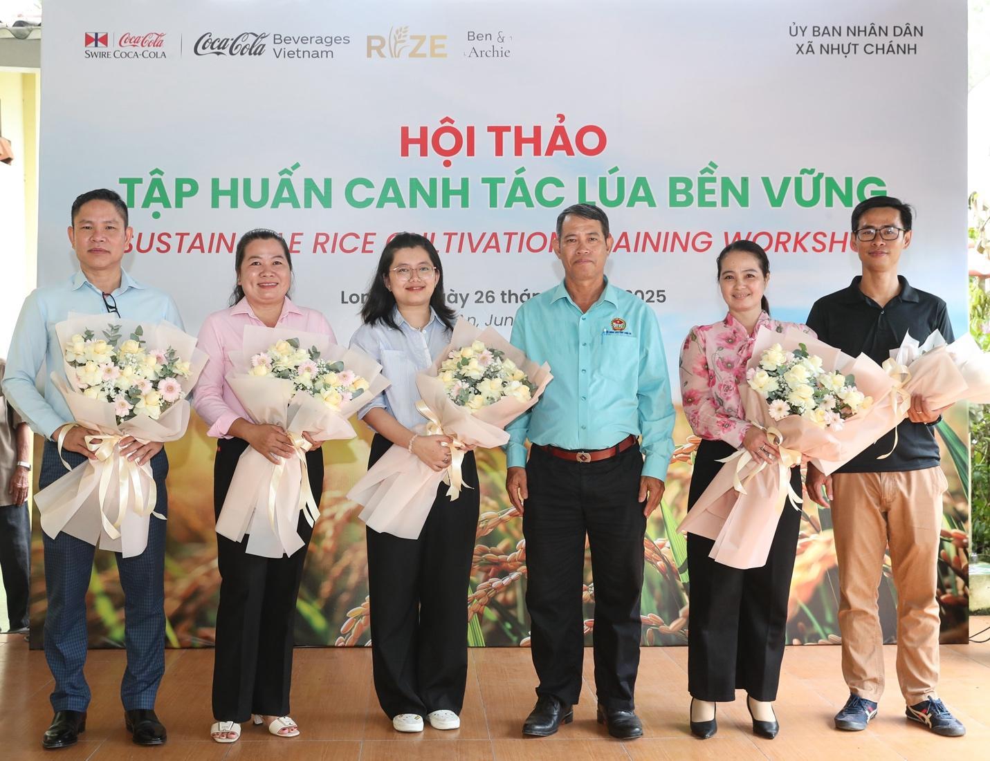 A group of people holding flowers    Description automatically generated
