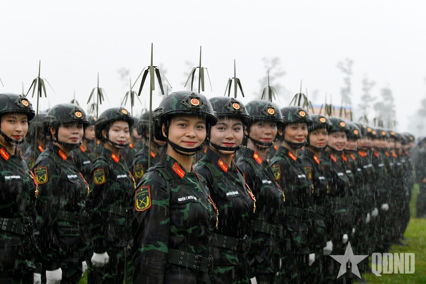The resilient beauty in the rain of the combined forces practicing for a parade