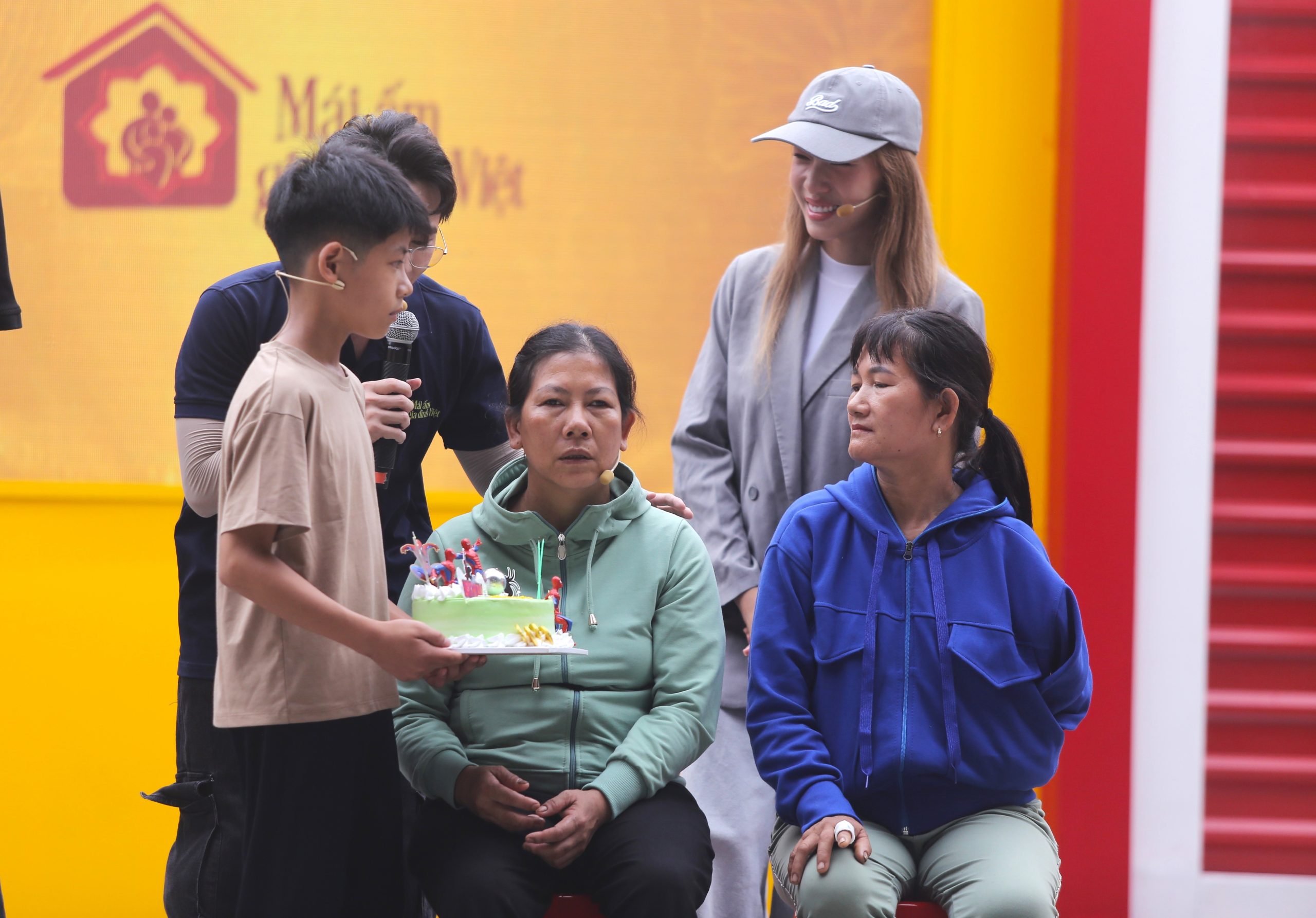 Thi Van Nam holds a birthday cake for his visually impaired mother. The 12-year-old boy's simple but touching wish.