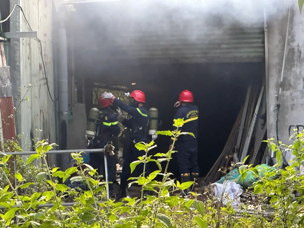 Firefighters try to put out the fire