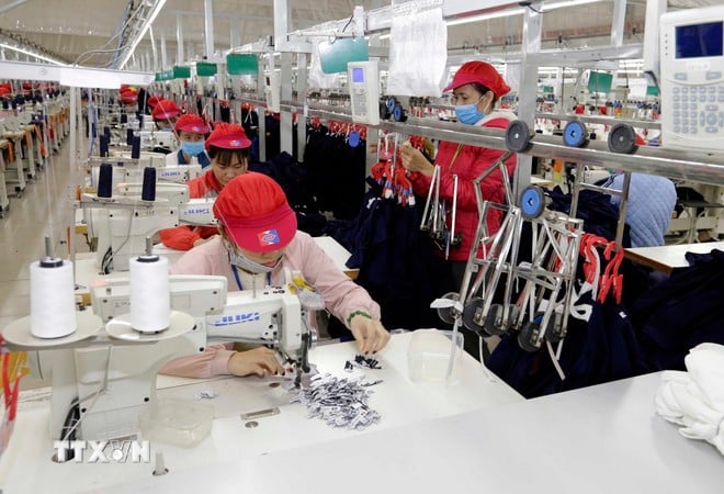 Sản xuất hàng dệt may xuất khẩu. (Nguồn: TTXVN)