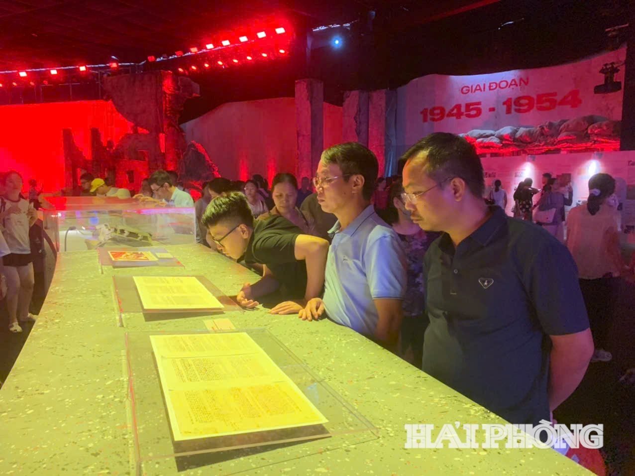 Mr. Bui Tuan Anh (first person from right) at the space where the Party flag has guided the way for 95 years.