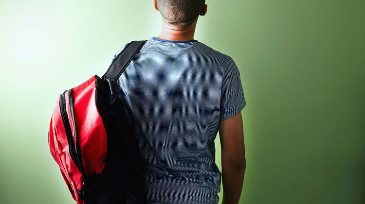 Carrying a backpack on one shoulder can cause neck stiffness and pain Shutterstock