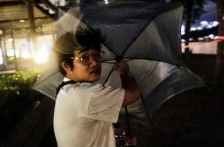 Strong winds blow away a man's umbrella as a typhoon approaches Hong Kong. (Photo: Getty)