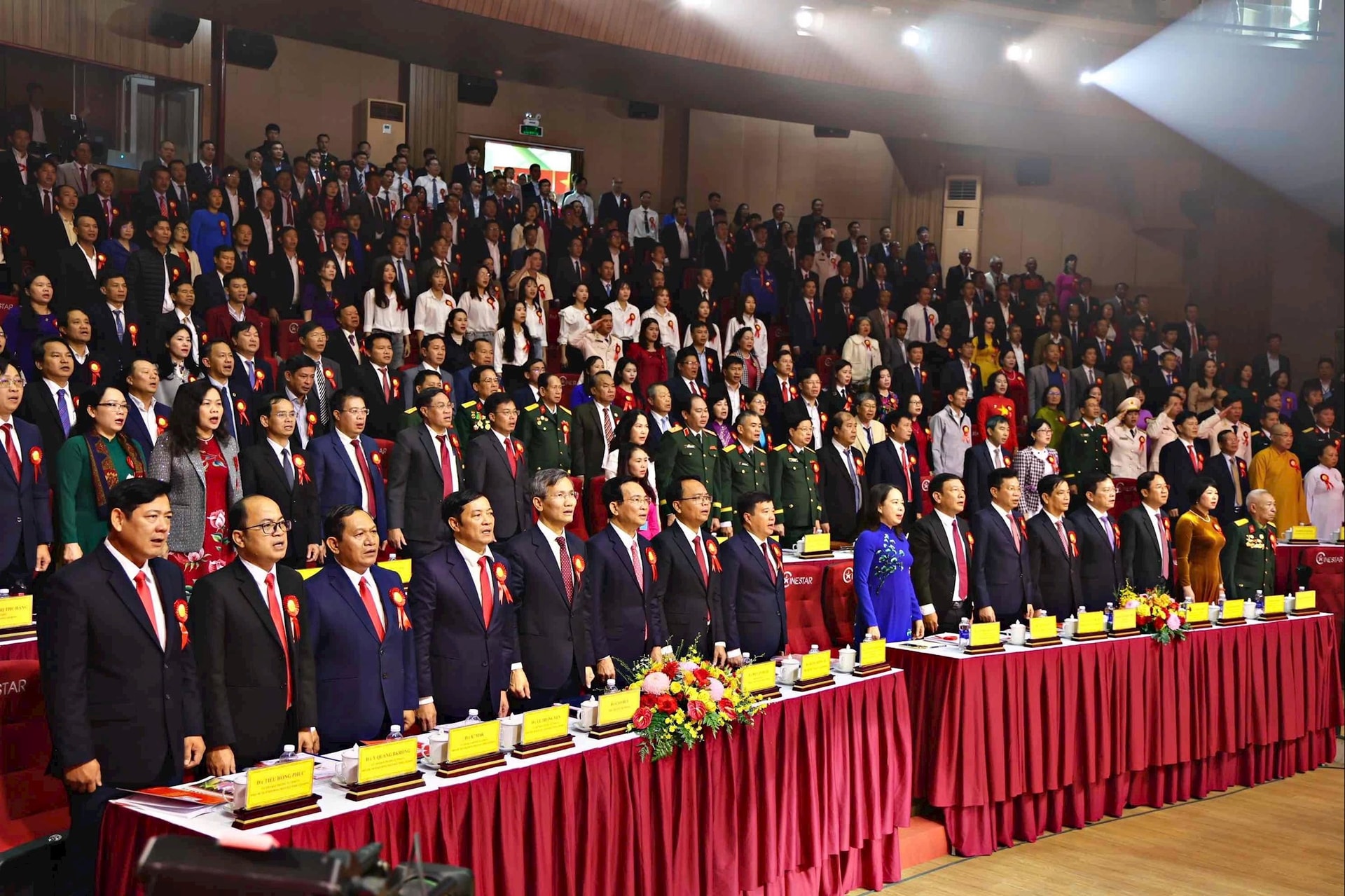 Delegates perform the flag-saluting ceremony