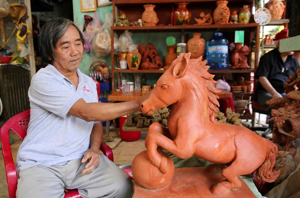 Visita a Thanh Ha per vedere i vasai che creano le mascotte per dare il benvenuto alla primavera - foto 11