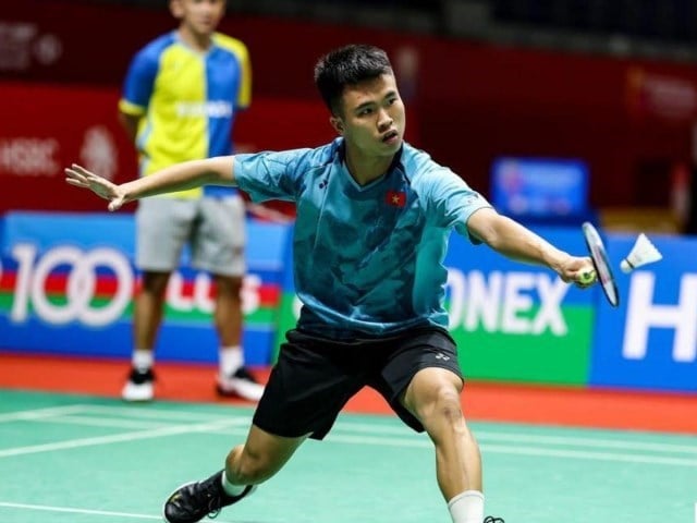 Giocatori di badminton vietnamiti in gara al torneo internazionale di Singapore - foto 1