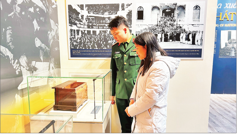 Tourists admire the unique ballot box.