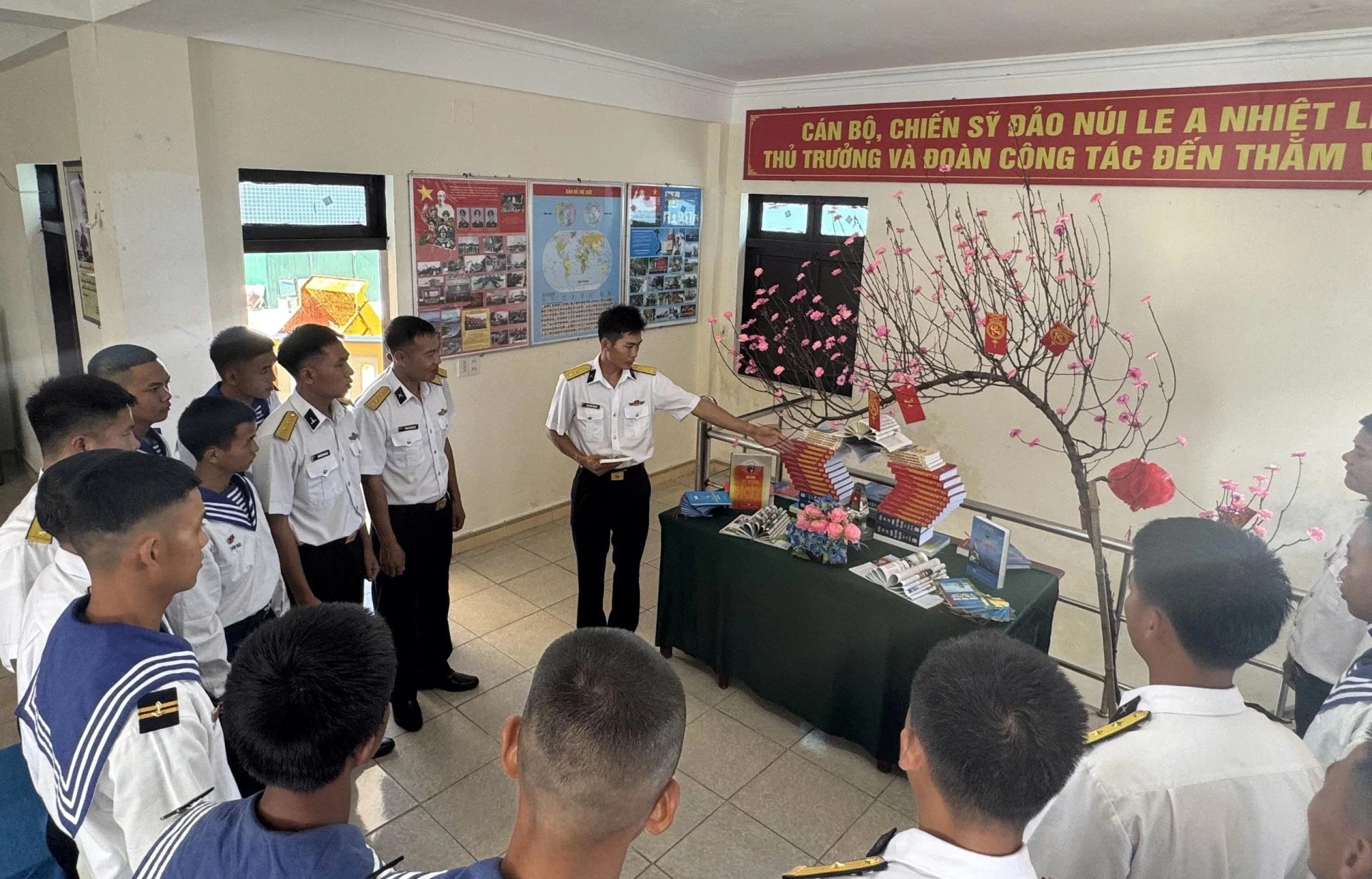 Officers and soldiers on Nui Le A Island introduce a wonderful book and a beautiful book model.
