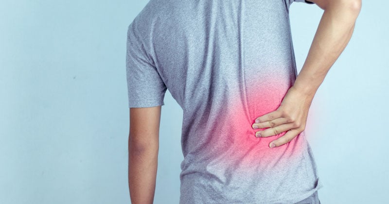 Đau lưng kéo dài, cảnh giác với trượt đốt sống thắt lưng- Ảnh 2.