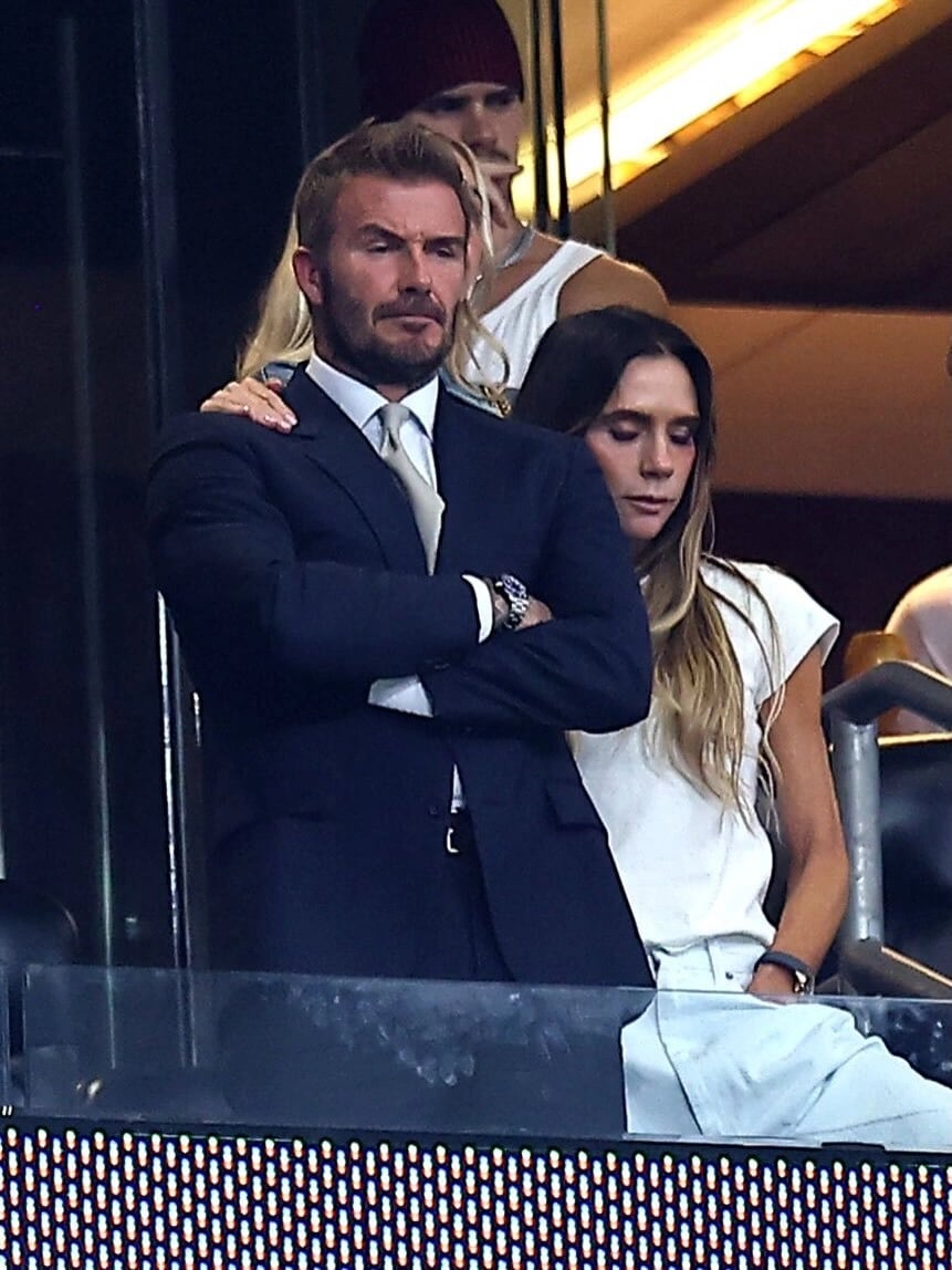 David Beckham receives comfort from his wife after England's defeat.